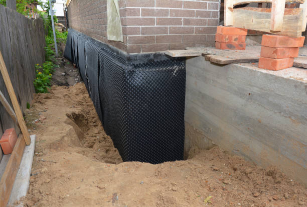 Happy homeowners after waterproofing job in Kansas